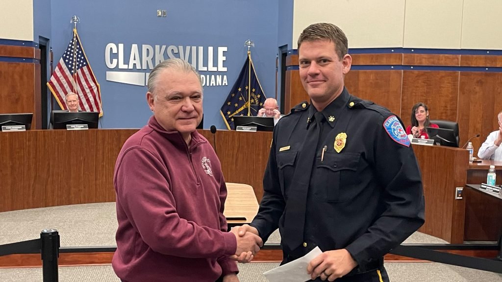 IAFF 2594 member accepts a check for Crusade for Children.