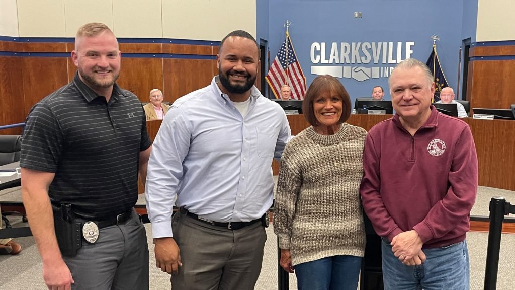 Clarksville FOP members accept a check for 'Shop with a Cop'.