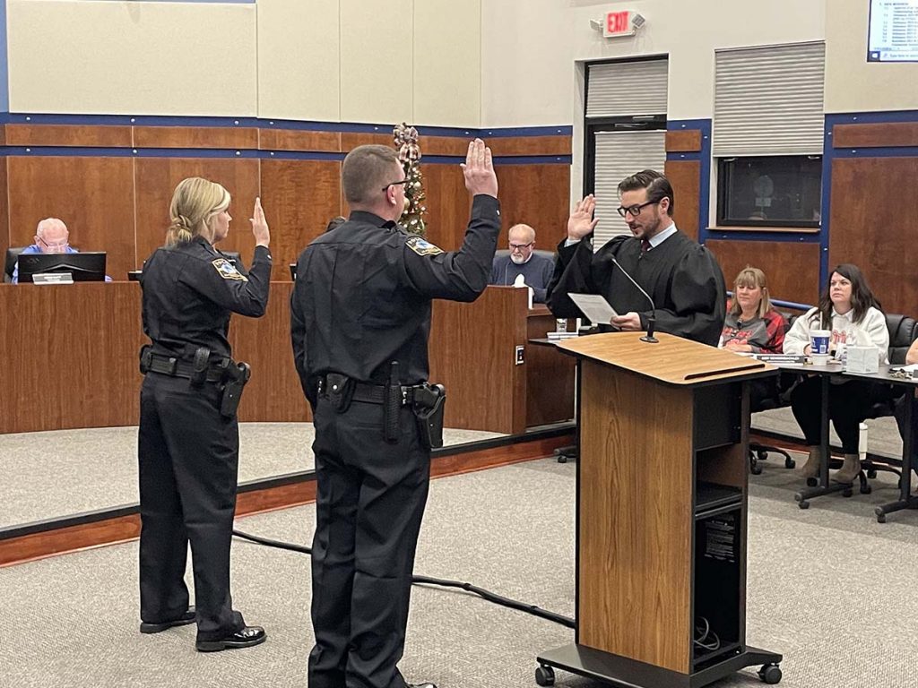 Officers Schnell and Leonhardt are take their oath of office.
