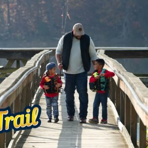 Dad fishing with two sons.