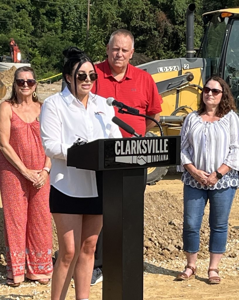 Victoria Johns stands at the podium